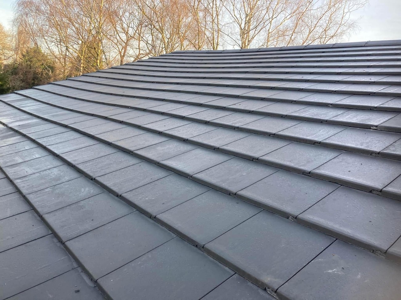 Clean new grey tiled roof after the job by Sturgeon's Roofing